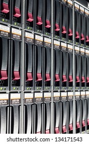 Side view on rack with multiple hard drives.