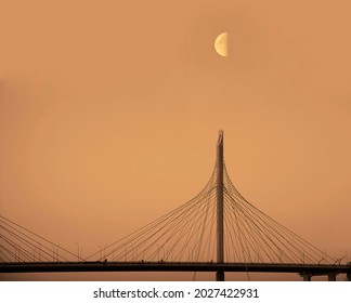 side view on road bridge at sunset with moving cars. Steel construction on a blue  sky background. cable stayed bridge. Saint Petersburg, Russia.