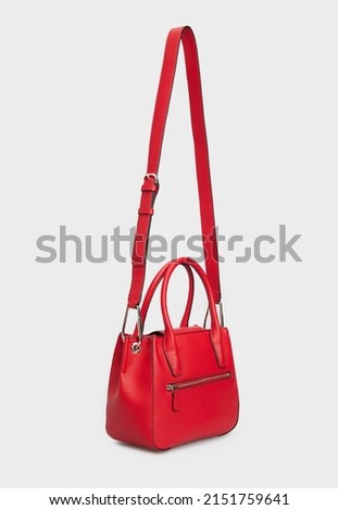 Side view on Women Red Leather Handle Hanging with long Belt Isolated on White Background
