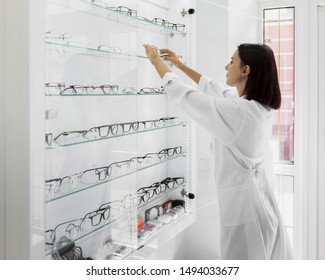 Side View Of Optician With Glasses Display