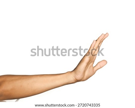 Side view of an outstretched hand making a stop gesture, symbol of denial, rejection, and stopping someone on isolated white background.