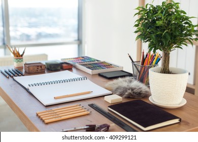 Side view of a painter workspace. Wooden desk with artistic tools prepared for pastel drawing. - Powered by Shutterstock