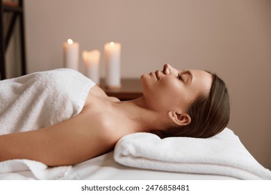 Side view of peaceful woman relaxing in spa salon after massage - Powered by Shutterstock