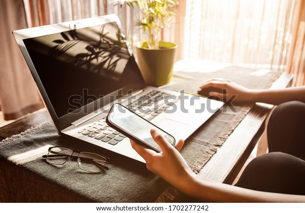 Side View Person Holding Phone Laptop Stock Photo (Edit Now) 1702277242