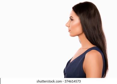 Side view photo of serious minded businesswoman in dark blue dress
