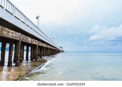 Side View Of Pier At The Beach At Sunset Time.Thailand.