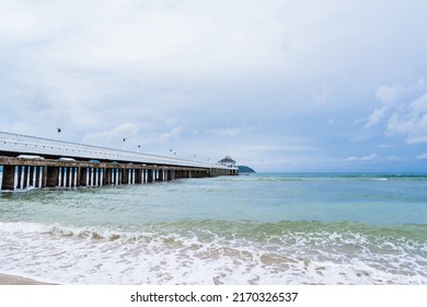 Side View Of Pier At The Beach At Sunset Time.Thailand.