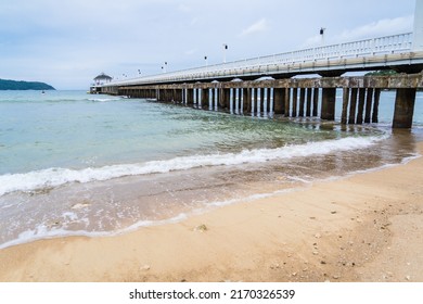 Side View Of Pier At The Beach At Sunset Time.Thailand.