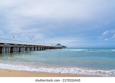 Side View Of Pier At The Beach At Sunset Time.Thailand.