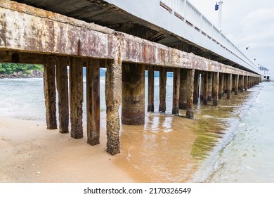 Side View Of Pier At The Beach At Sunset Time.Thailand.