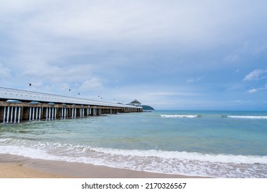 Side View Of Pier At The Beach At Sunset Time.Thailand.