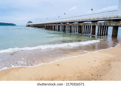 Side View Of Pier At The Beach At Sunset Time.Thailand.