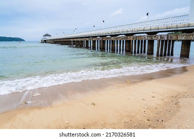 Side View Of Pier At The Beach At Sunset Time.Thailand.