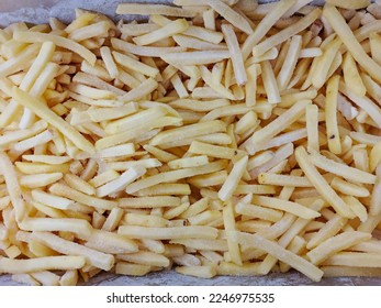A side view of a pile of frozen potatoes in a store  - Shutterstock ID 2246975535