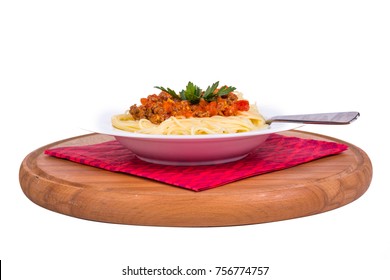 Side View Of Plate Of Spaghetti Pasta With Tomato Bolognese Sauce, Isolated On White Background.