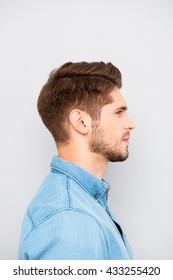 Side View Portrait Of Handsome Man In Blue Shirt