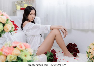 Side view portrait highlighting the model's legs, shoulder, and body lines. She turns her head to make confident eye contact. Sexy, sleek, and alluring look.