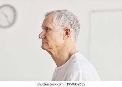 Side View Portrait Of Senior Man In Hospital With Focus On Oxygen Support Tubes, Copy Space