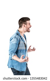 Side View Portrait Of Young Angry Man In Casual Clothes Showing Some Rage Emotion. Isolated On White Background.