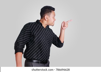 Side View Portrait Of Young Asian Man, Angry Mad Boss Pointing, Isolated On Grey