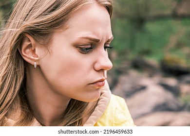 Side view portrait of a young serious upset woman clenching her teeth with a tense jaw. - Shutterstock ID 2196459633