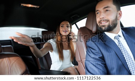 Side view of pretty couple in car. cropped image.
