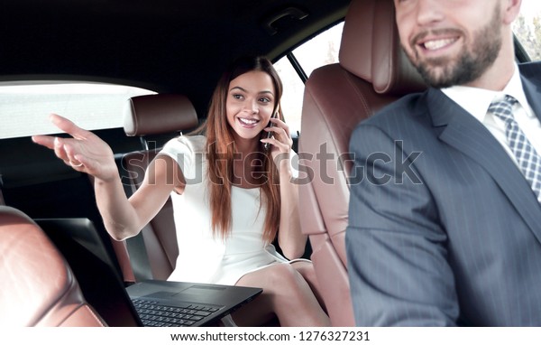 Side view of\
pretty couple in car. cropped\
image.