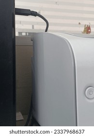 the side view of the printer that has been plugged into the CPU via USB