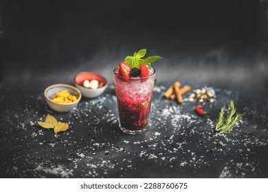 Side View of Refreshing Berry Smash Cocktail with Blueberry, Strawberry, and Mint Garnish - A Delicious and Fruity Drink for Summer