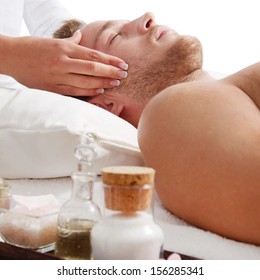 Side View Of Relaxed Man Getting Scalp Massage