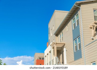 Side view of a residential building with beige vinyl lap sidings at Daybreak