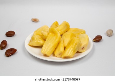 Side view of ripe Jackfruit in white plate isolated in white background side view with jackfruit seeds