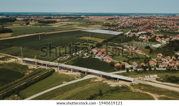 A side view of a road\
under construction in a Brcko district background, Bosnia and\
Herzegovina