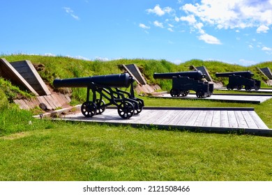 Side view of row of cannons on display at Victoria Park during Summer