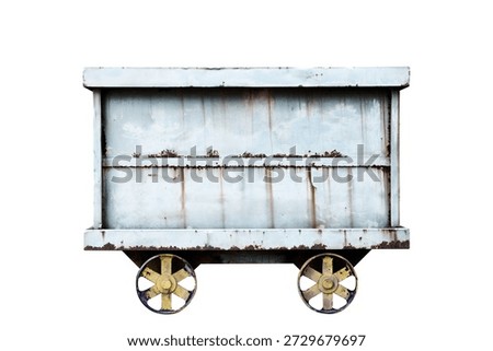 Side view of rusted old mining cart on white background.
