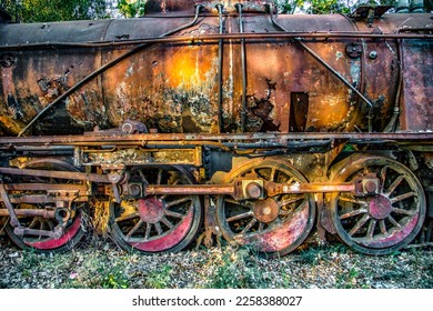 Side view of a rusty train abandoned