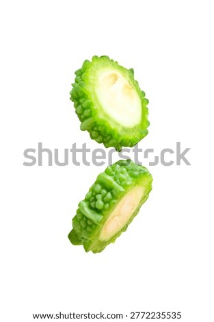 Side view set of green bitter gourd or bitter melon in slices in circle shape is isolated on white background with clipping path.