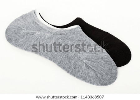 Side view of set of new pairs beautiful unisex stretch blank sock isolated on abstract white background. Nice natural and soft cotton fabric. Wearing and sport clothes concept. Closeup studio shot