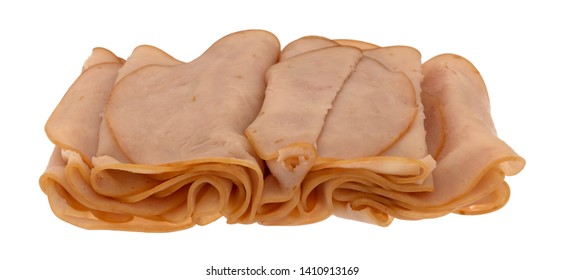 Side View Of Several Thin Smoked Turkey Slices Isolated On A White Background.