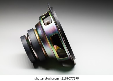 Side View Of Shiny Audio Speaker Is On A White Background With Soft Shadow, Hi-Fi Audio System Component, Close-up Photo