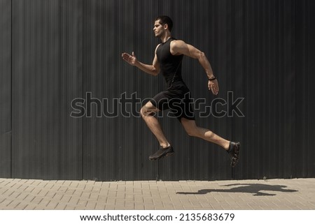 Similar – Image, Stock Photo Young man stretching in the city after jogging