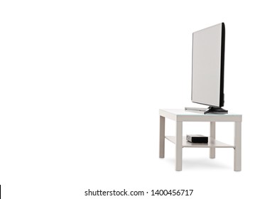 Side View Shot Of A Flat Screen TV On A White Shelf Isolated On White Background