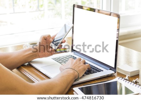 Side view shot of a man's hands using smart phone in interior, rear view of business man hands busy using cell phone at office desk, youngmen student typing on phone sitting at wooden table