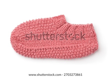 Side view of single pink hand knitted wool slipper sock isolated on white