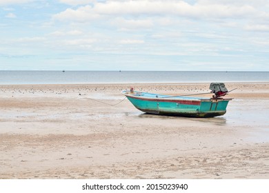 Side View Of Small Fishing Boat On Sand Beach, Peaceful Scenery Of The Coast Of Thailand.