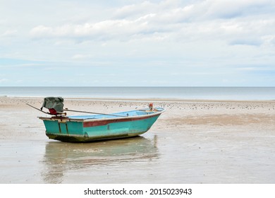 Side View Of Small Fishing Boat On Sand Beach, Peaceful Scenery Of The Coast Of Thailand.