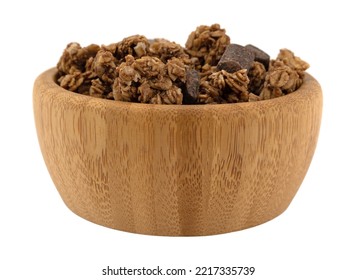 Side view of a small wood bowl filled with chocolate chunk granola on a white background. - Shutterstock ID 2217335739