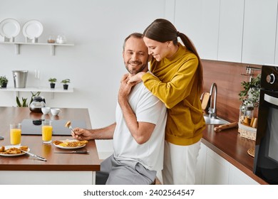 side view of smiling man enjoying tasty breakfast near caring wife in kitchen, child-free couple - Powered by Shutterstock