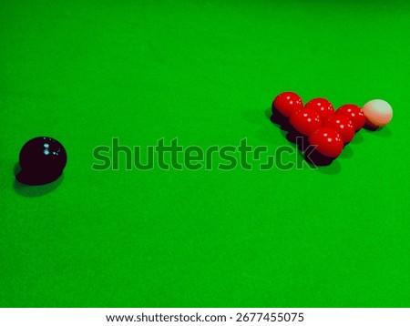side view of snoker table balls with green background 