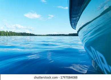 Side View Speeding Fishing Motor Boat With Drops Of Water. Blue Ocean Sea Water Wave Reflections With Fast Fishing Yacht. Motor Boat In The Blue Ocean. Ocean Yacht. Sailboat Deck